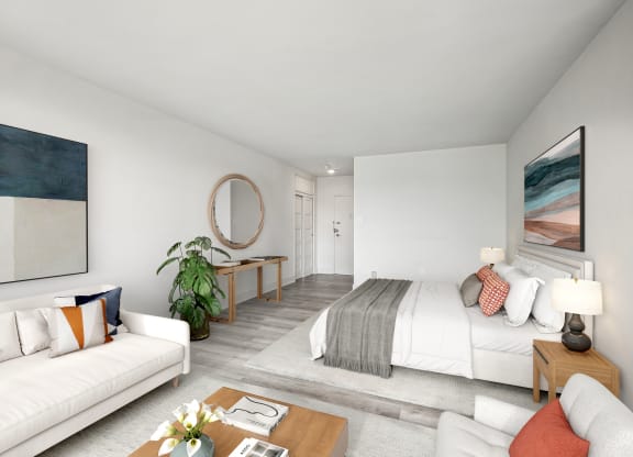 a living room with a couch and a bed