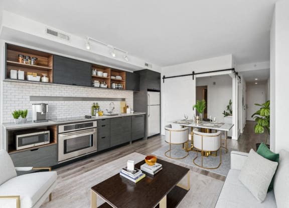 a living room with a kitchen and a dining room