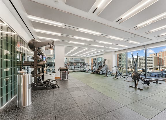 A gym with a variety of exercise equipment.