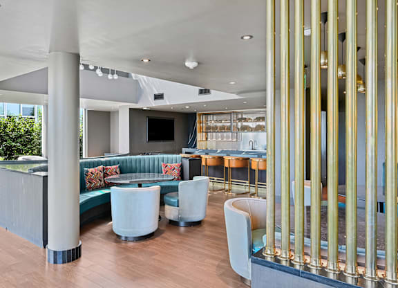 A modern interior with a bar and seating area.