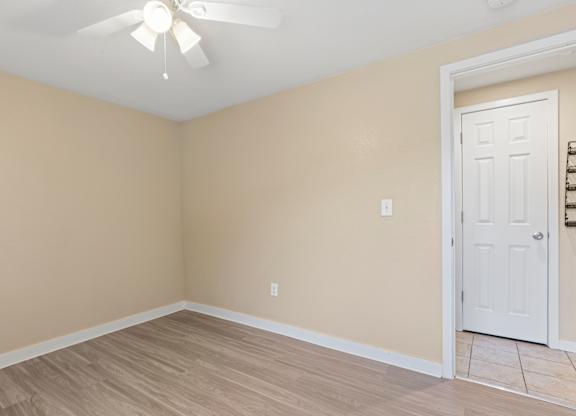 room with a white ceiling fan at Kingsbrook Arms, Englewood, Co