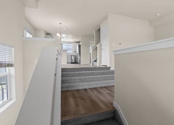 Grey carpeted staircase at The Townhomes at Pine Drive, Colorado