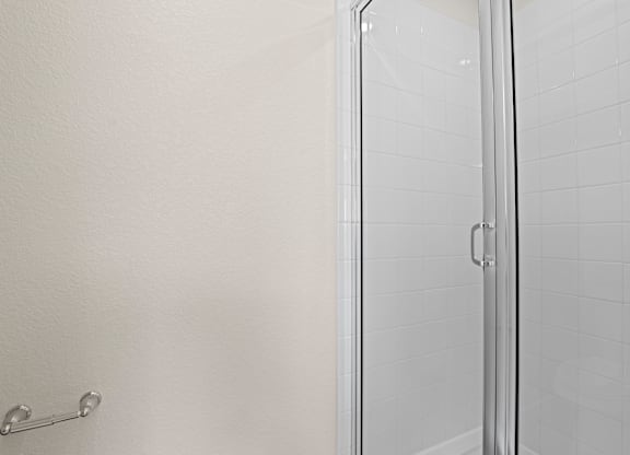 Modern bathroom with a glass shower door at The Townhomes at Pine Drive, Parker, Colorado