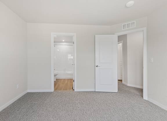 Room with a carpeted floor at The Townhomes at Pine Drive, Parker, Colorado