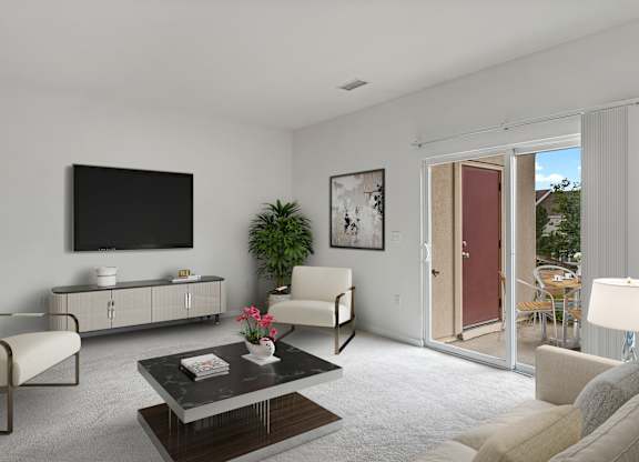 A living room with a flat screen TV mounted on the wall.