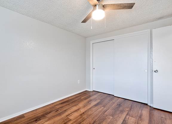 room with wooden floor at Kingsbrook Arms, Englewood Colorado