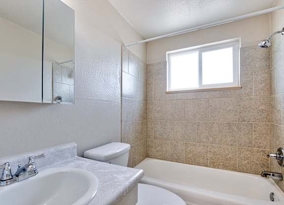 white bathroom with a sink at Kingsbrook Arms, Colorado, 80113