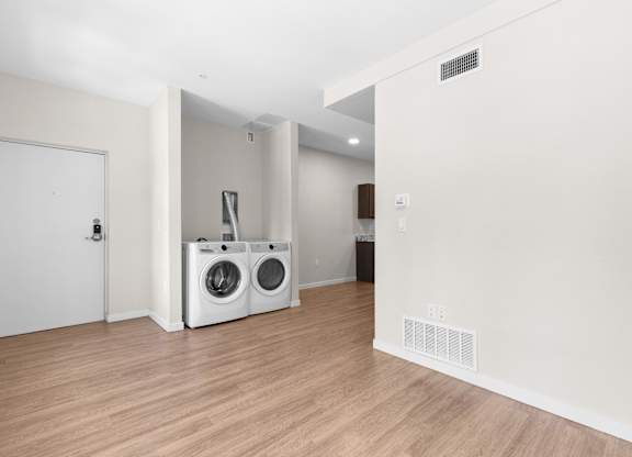 A laundry room with a washer and dryer.