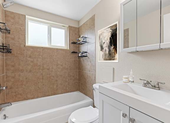 bathroom with white tub at Kingsbrook Arms, Englewood, 80113