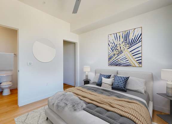Bedroom with a Bed at Proto Apartments, Denver, CO