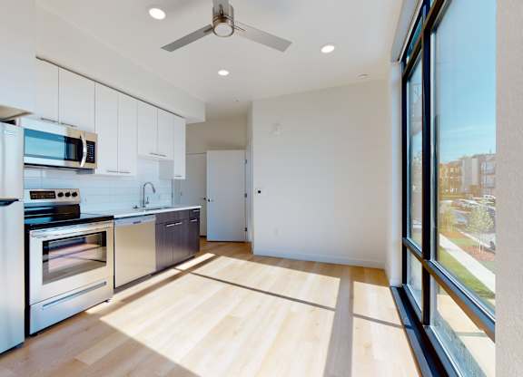 Kitchen with Wooden Floor at Proto Apartments, Denver, CO, 80204
