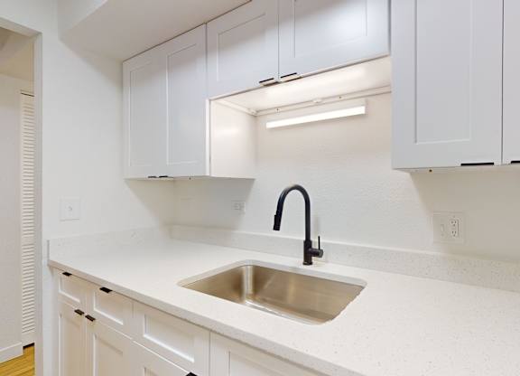 Kitchen with Stainless Steel Sink at Villa Parada Apartments, Colorado