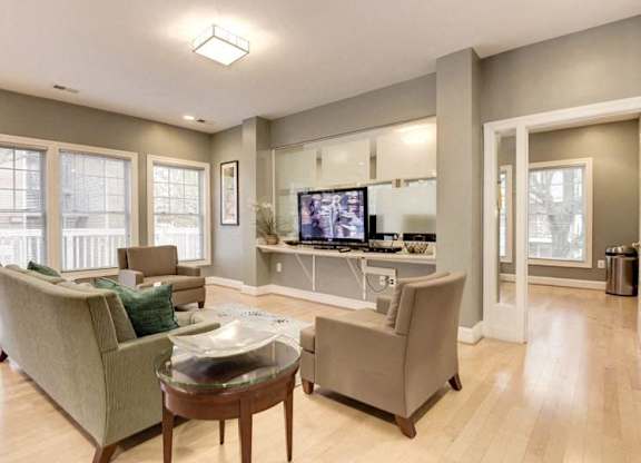 A living room with a couch, chair, and coffee table.