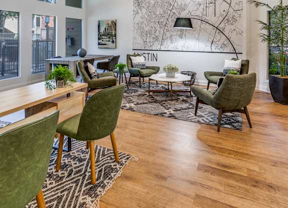 a living room filled with furniture and a large painting on the wall