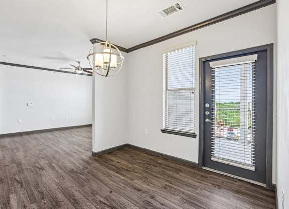 A room with a sliding door and a ceiling fan.