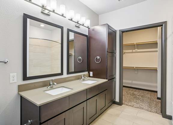 A bathroom with a vanity and a toilet.