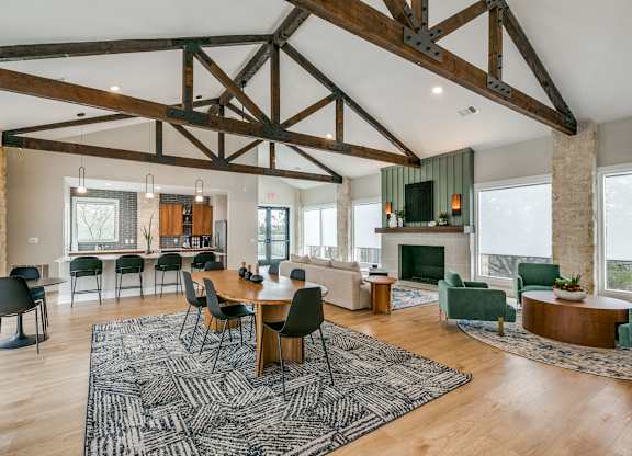a large living room with a dining room table and a fireplace at Canyon Ridge, Texas