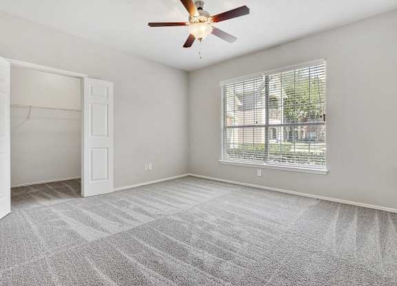 Carrington Park Apartments in Plano, TX with Wall to Wall Carpet, Walk-In Closet, Gray Walls, Large Window