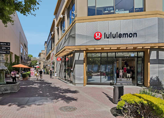 A Lululemon store is located in a shopping plaza.