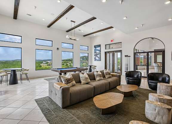 A spacious living room with a large couch and a coffee table.