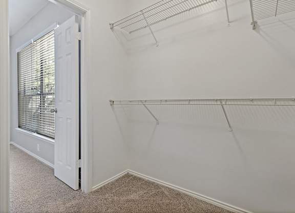 View into bedroom from walk-in closet