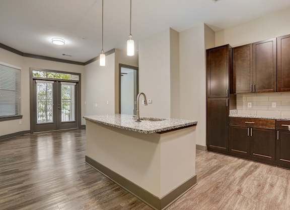 Pet-Friendly Apartments in Nashville, TN- Octave Apartments- Kitchen Island with granite countertops