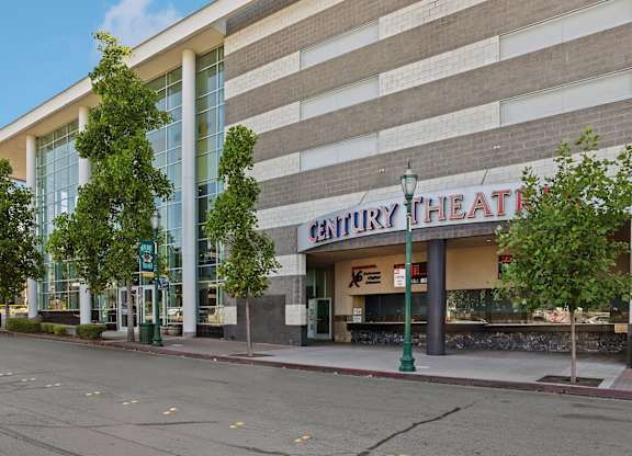 Century Theatre is a large building with a lot of windows.