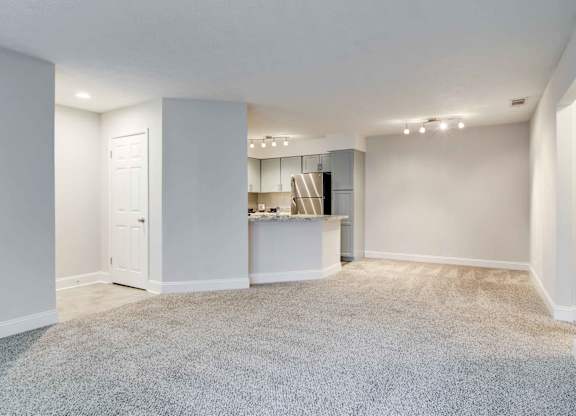 Apartments in Roswell, GA for rent - 2200 Big Creek Apartments - Living room area with ample space and plush carpet