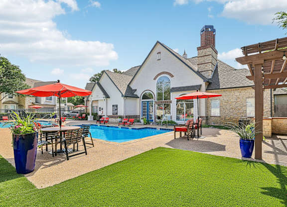 A house with a pool and a patio area.