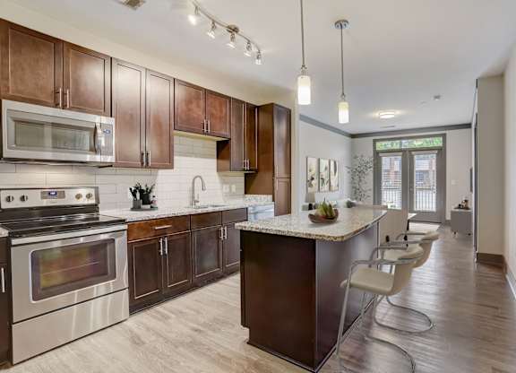 Nashville Apartments - Octave Apartments - Luxury Kitchen with gourmet Island countertop and stainless steel appliances