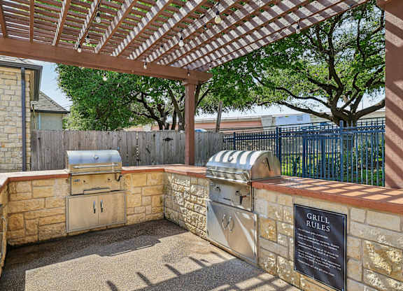 A grill area with a grill rules sign.