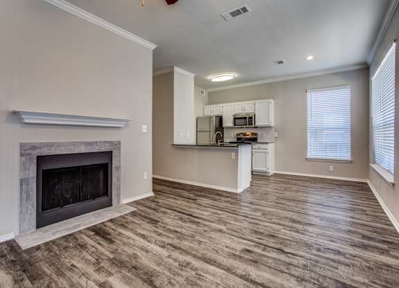 Apartments in Plano, TX - Modern Living Room with Hardwood Flooring and Access to Kitchen