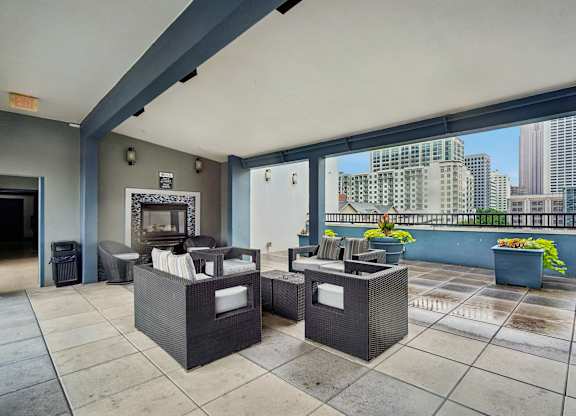 A patio with two couches and a table.