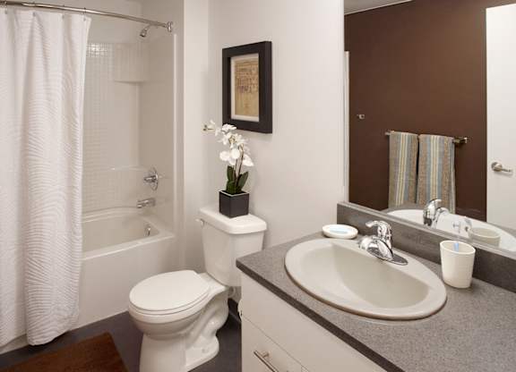 a bathroom with a sink toilet and a bath tub