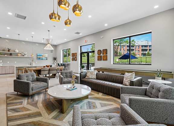 A modern living room with grey and gold furniture.