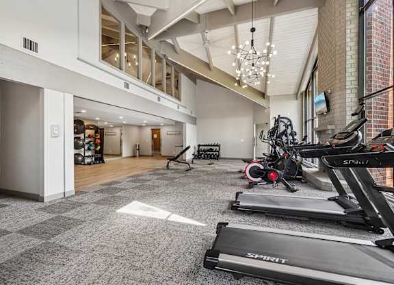 A gym with treadmills and exercise bikes.
