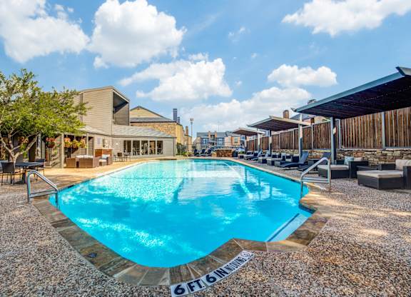 A swimming pool with a 6FT depth sign on the side.