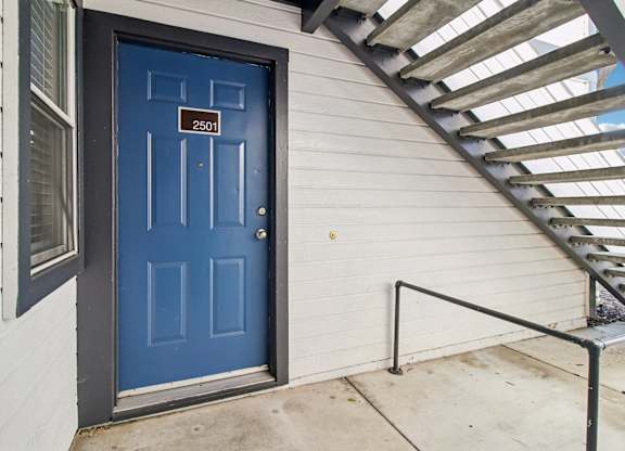 A blue door with the number 2501 on it.