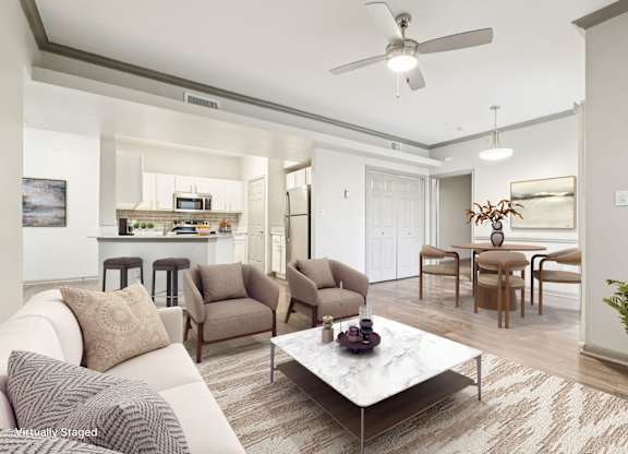 A living room with a white couch and a coffee table.