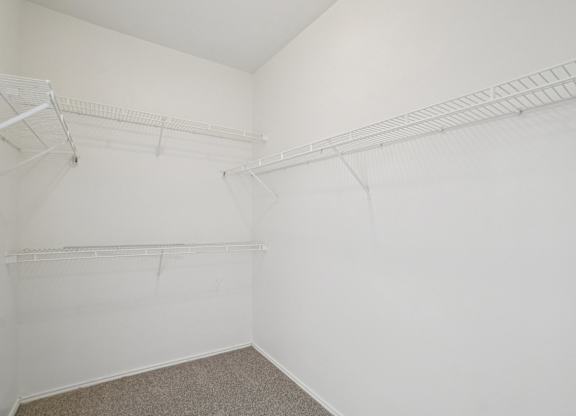 A white room with two shelves.