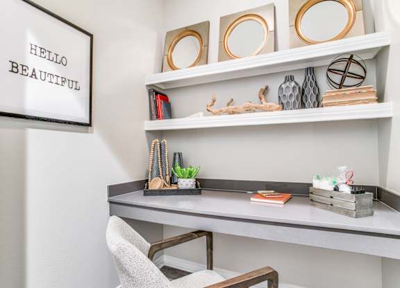 Dallas TX Apartments-Office Area With Granite Built In Desk and White Wooden Shelves