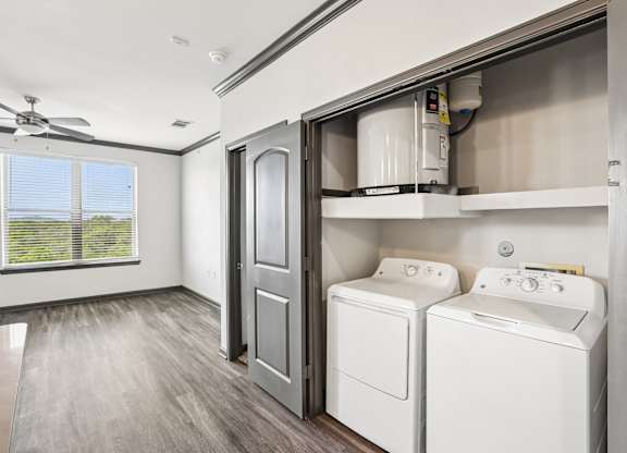 A laundry room with a washer and dryer.