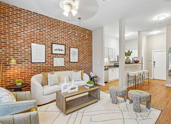 A living room with a white couch and a coffee table.