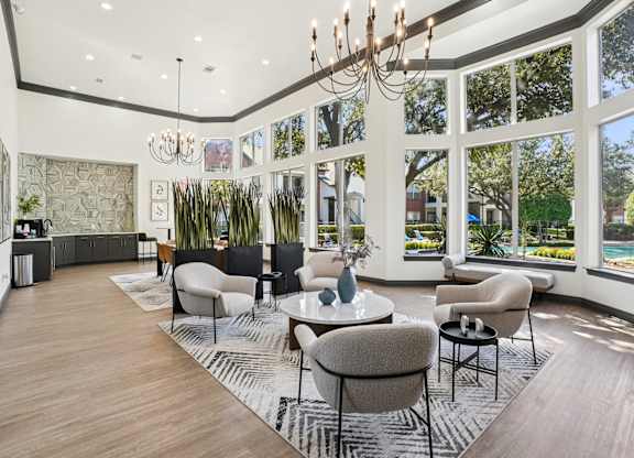 A large room with a lot of windows and a chandelier.
