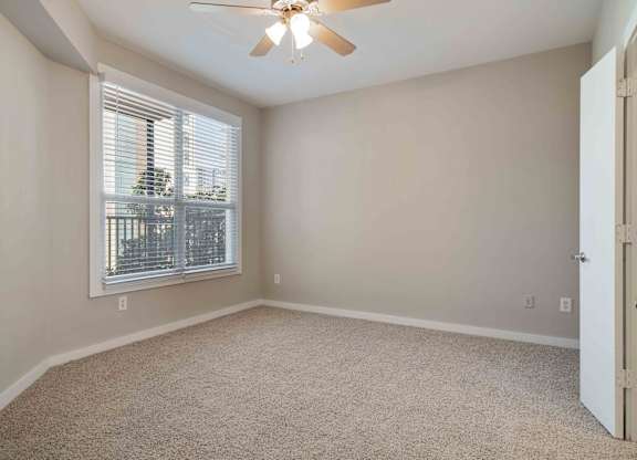 Atlanta, GA Apartments - Biltmore at Midtown -Bedroom with Large Windows