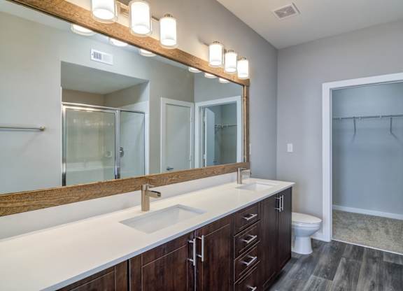 Atlanta, GA Apartments - Biltmore at Midtown -Luxury Bathroom with Large Vanity and Storage Space