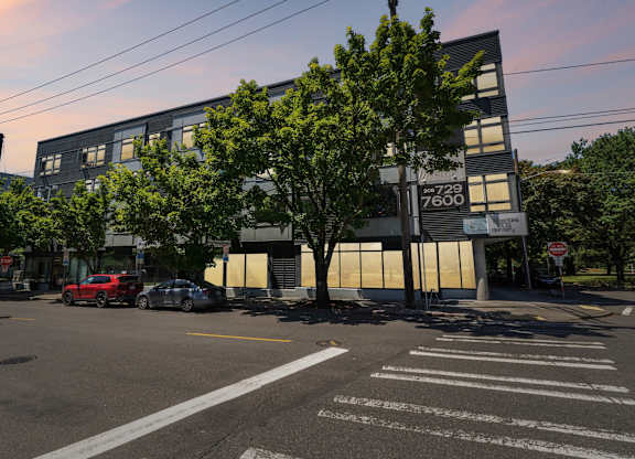 A street view of a building with the number 7600 on it.