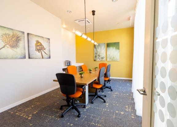 a conference room with a long table and chairs