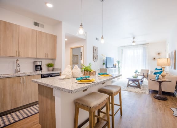 an open floor plan with a kitchen and living room
