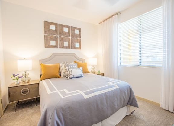 One BR Apartment In Gilbert, AZ - Spacious Bedroom With Carpet Flooring, Window, And Central Air.